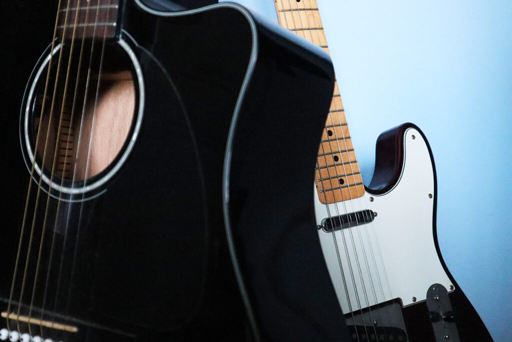 Fender acoustic and fender telecaster guitars