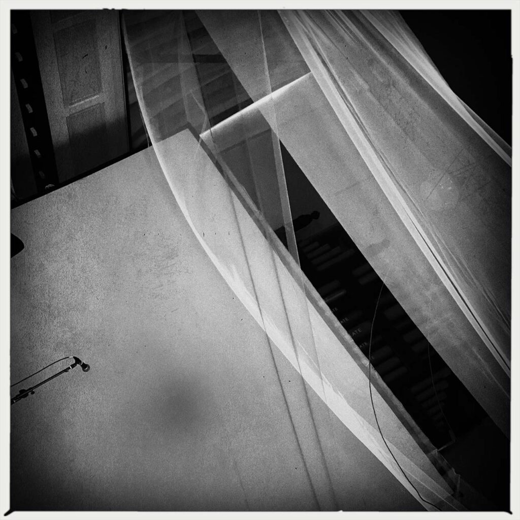 black and white empty stage with microphone